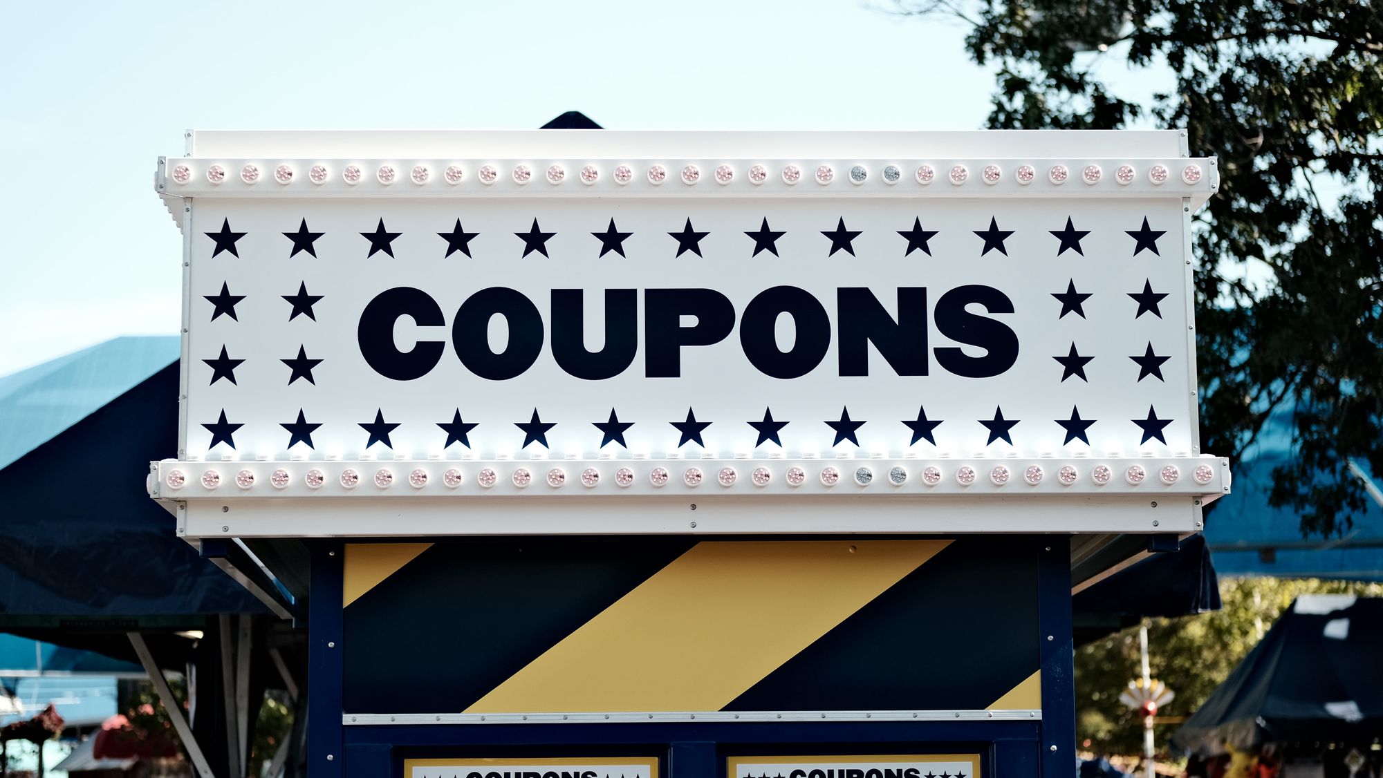 Display sign with big, bold letters that says COUPONS.