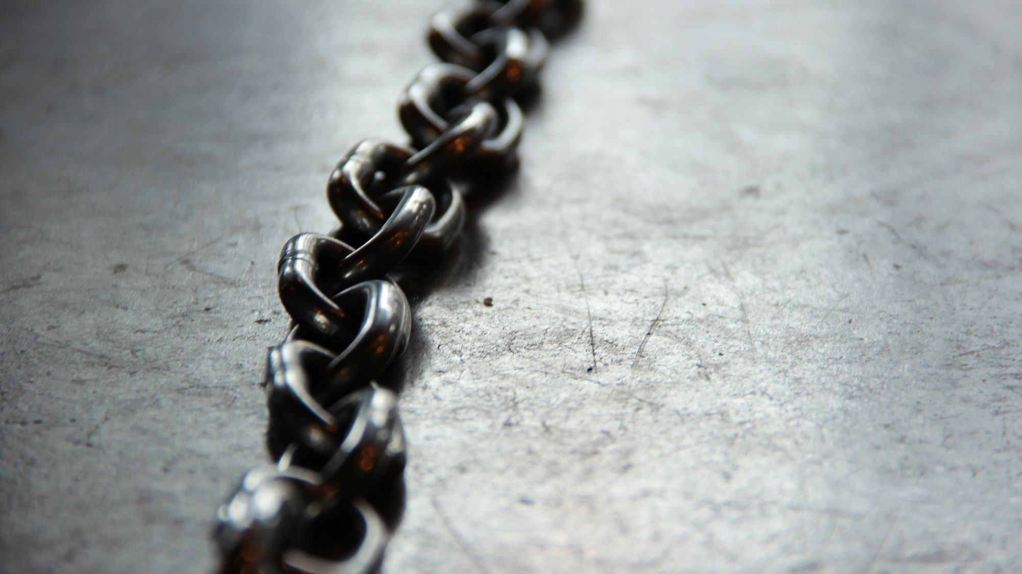 Iron chain laying across the floor.